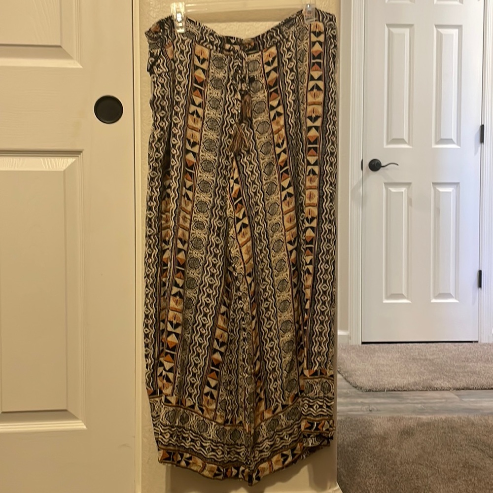Worn once and washed . Flowy pants cute with a black bathing suit